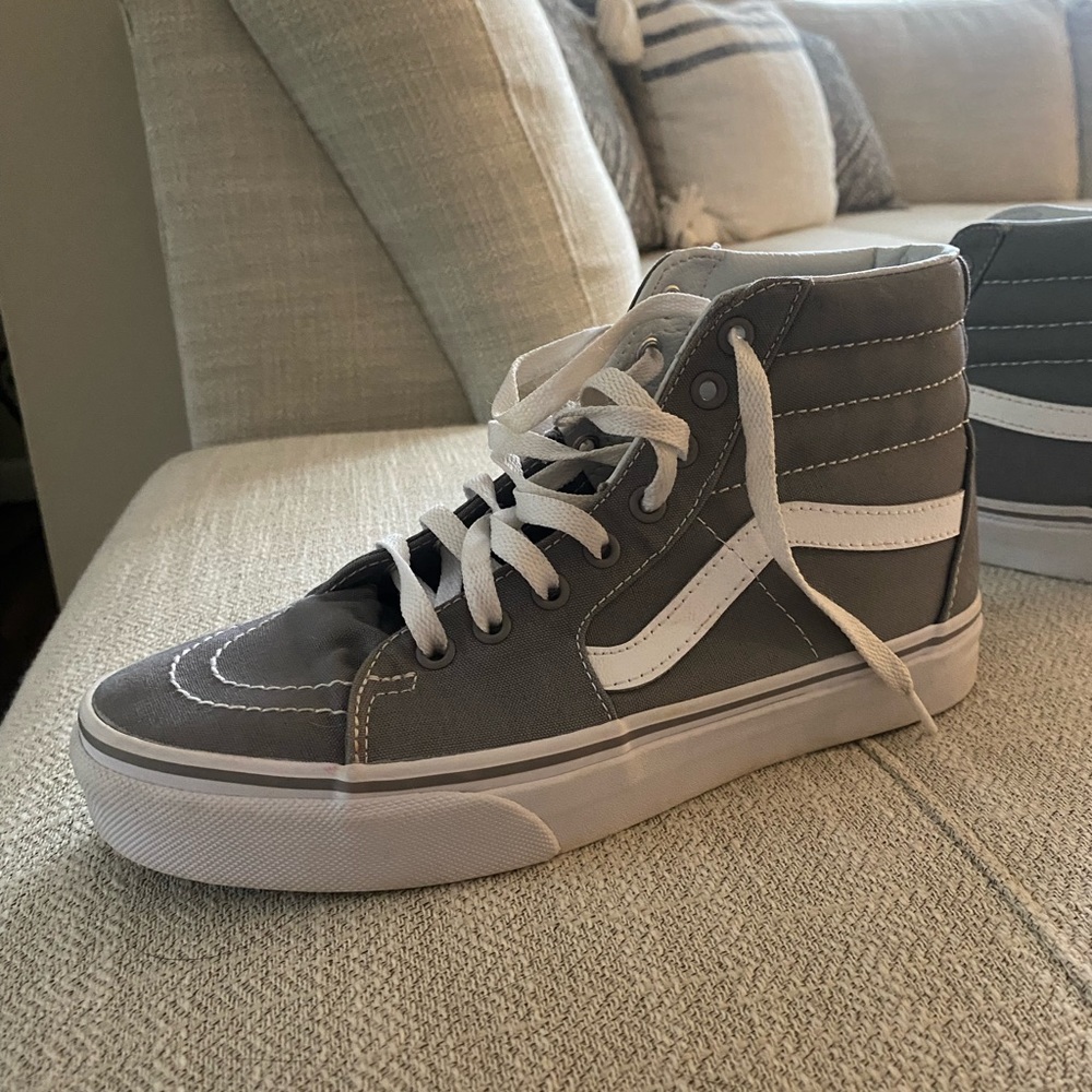 Grey high top vans lightly warn